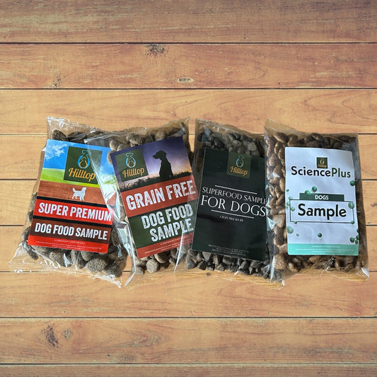 Hilltop Pet Food Dog Food Samples 4x100g Pic-n-Mix, ideal for picky dogs, displayed side by side on wood.