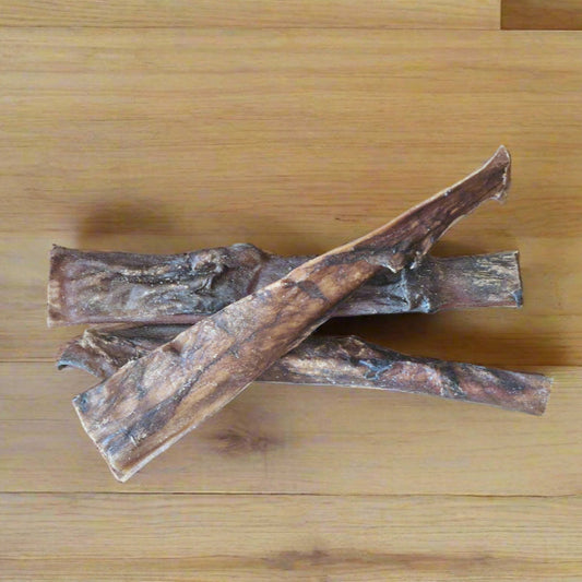 3 strips of beef headskin on a wooden worktop