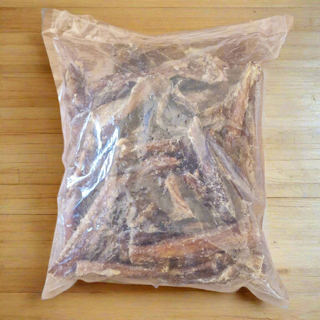 1kg bag of beef paddywack on a wooden worktop