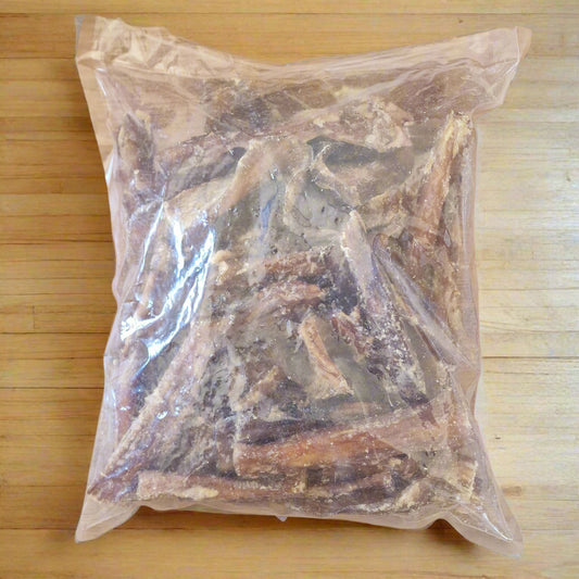 1kg bag of beef paddywack on a wooden worktop
