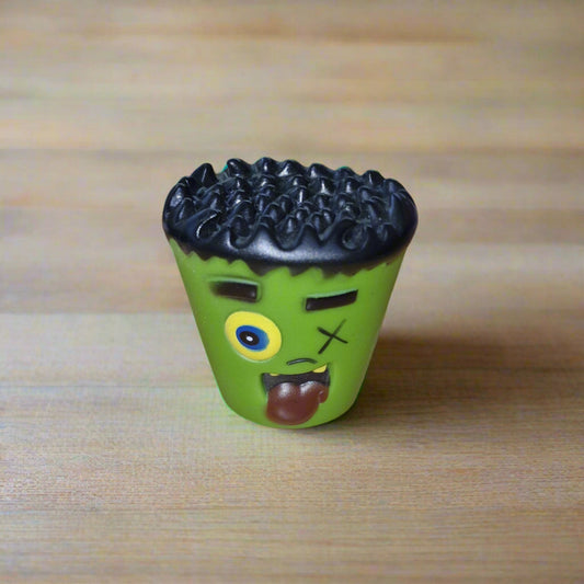 green squeaky monster dog toy