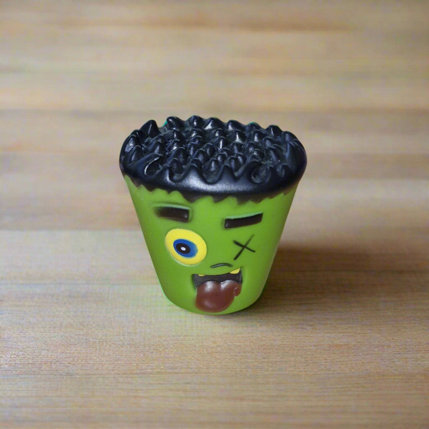 green squeaky monster dog toy
