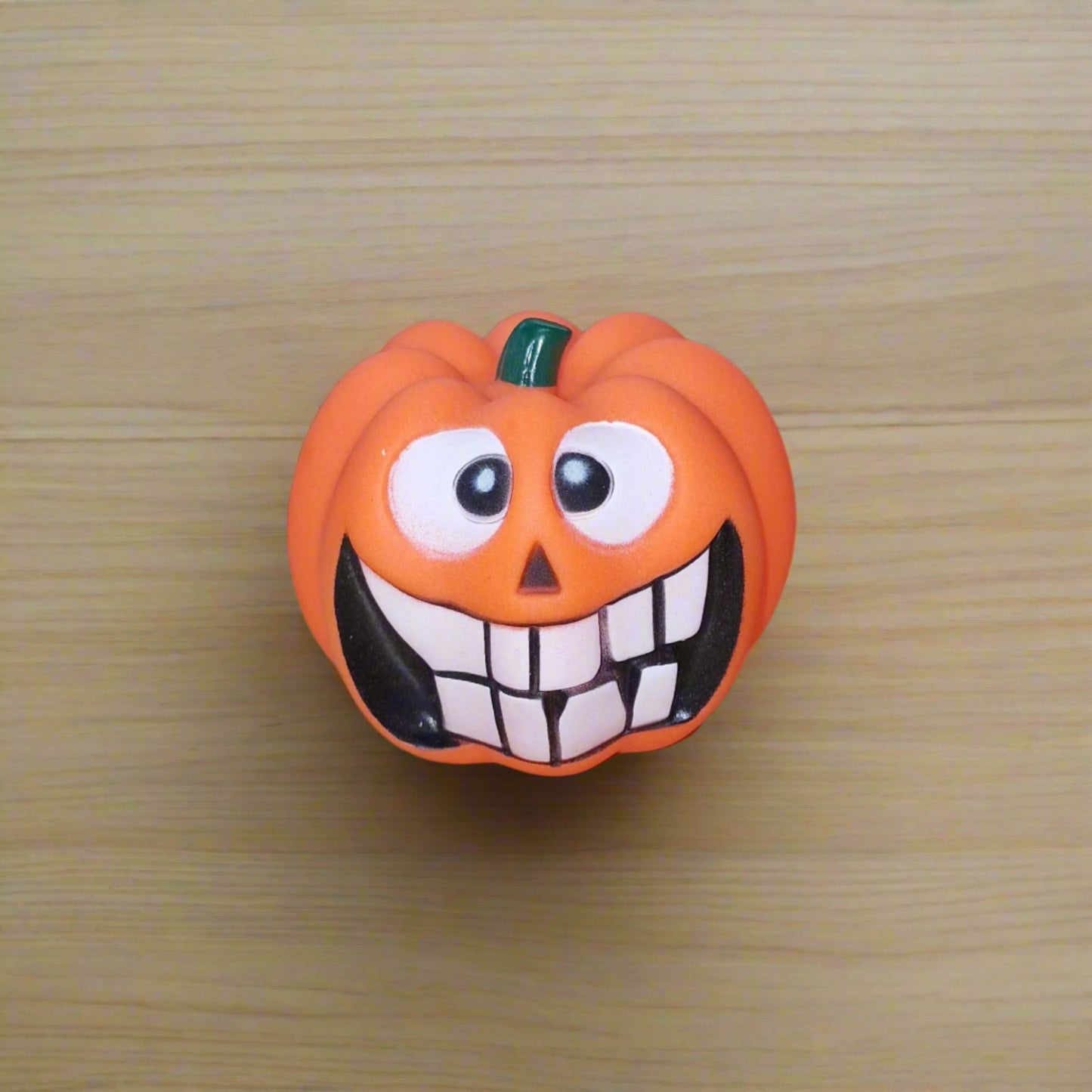 orange pumpkin squeaky dog toy
