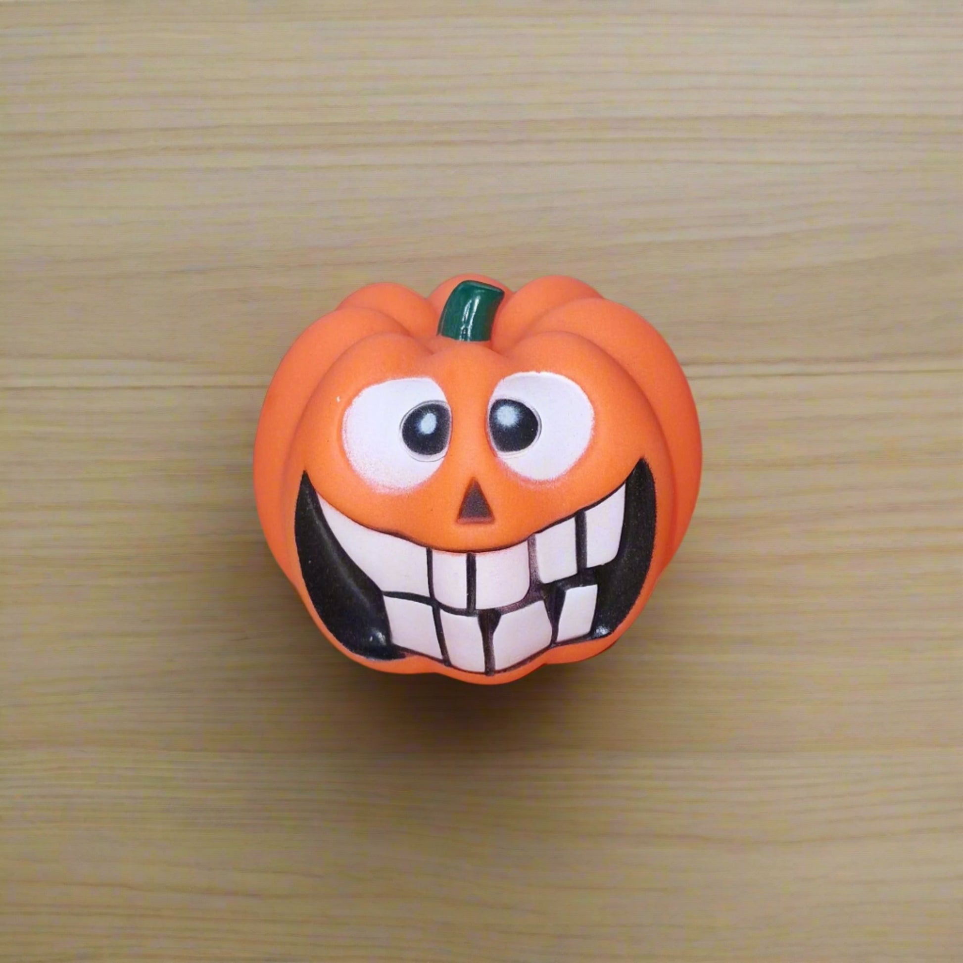 orange pumpkin squeaky dog toy