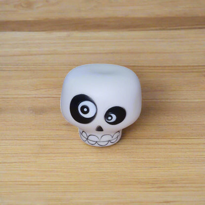 white squeaky skull dog toy